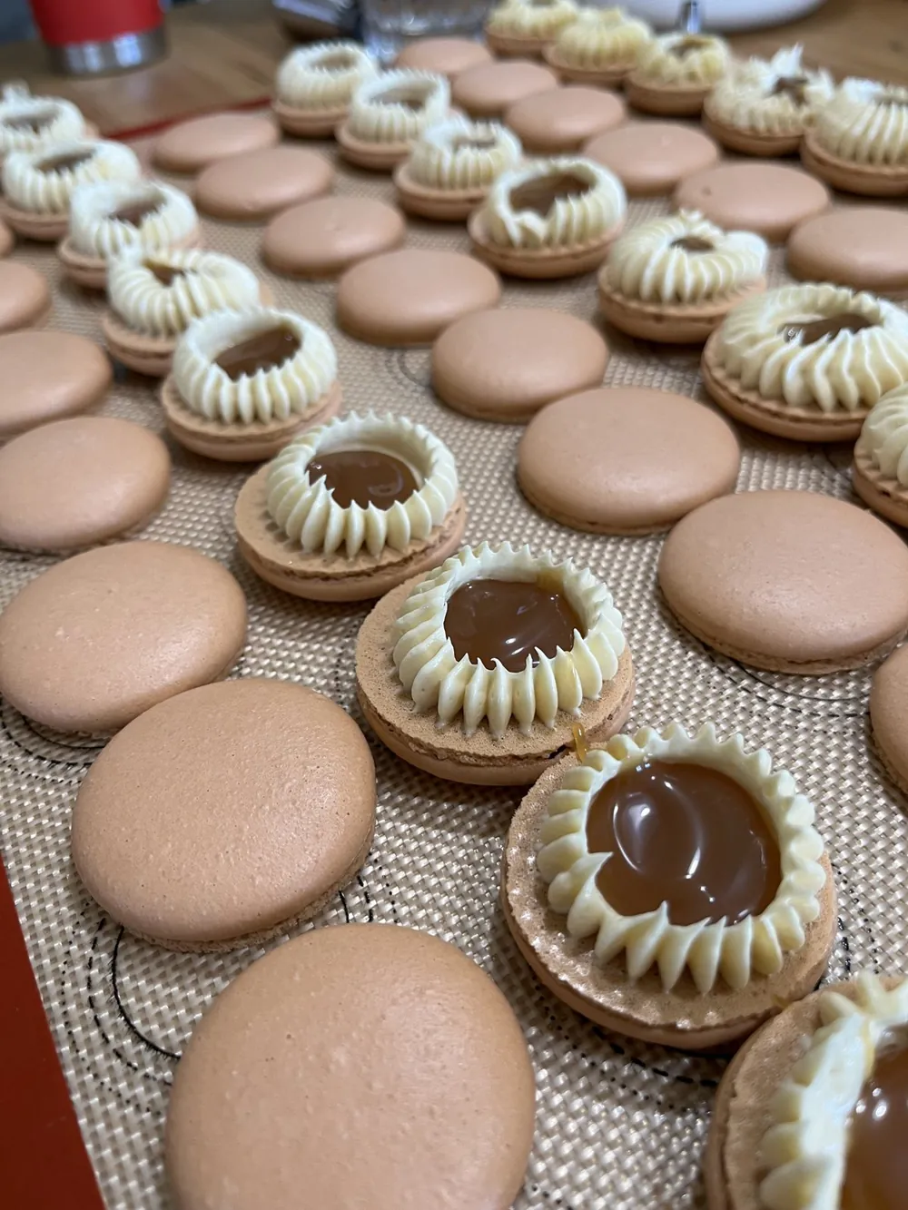Close-up of filled macarons showing the ganache center