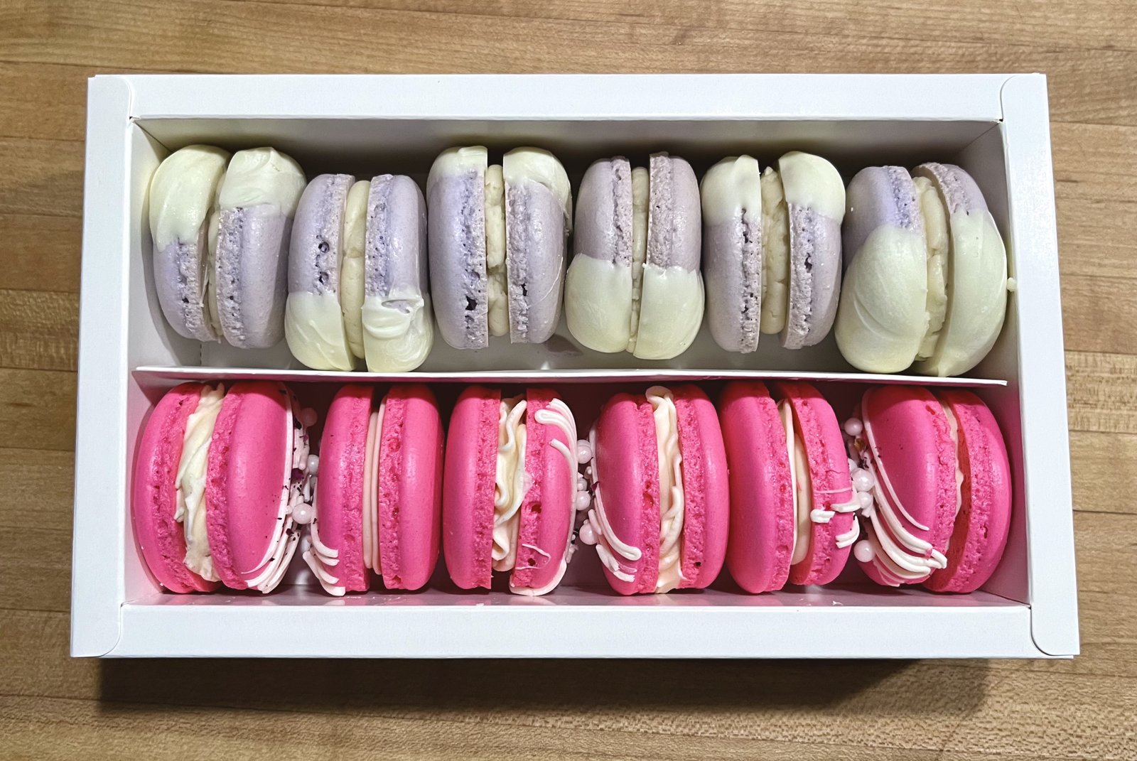 Lavender and raspberry macarons boxed for an order